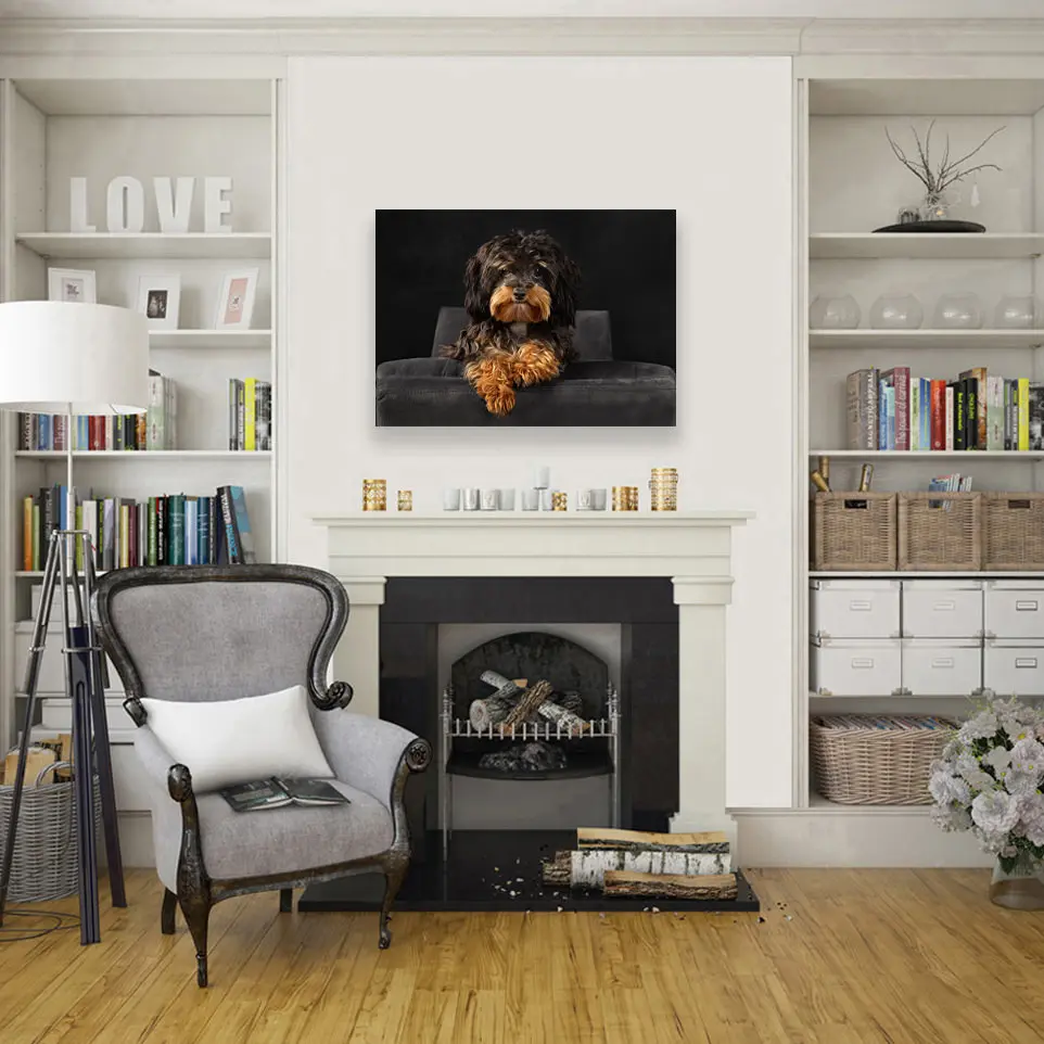 Cozy living room with dog portrait hanging above fireplace